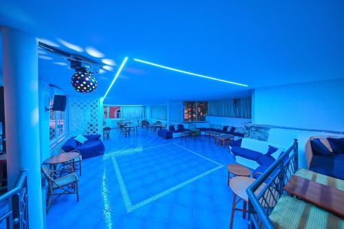 a living room with blue lights in a room at Av Club Terme Colella in Ischia