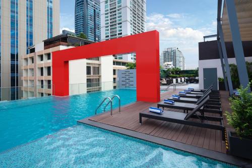 a pool on the roof of a building at Four Points by Sheraton Bangkok, Sukhumvit 15 in Bangkok