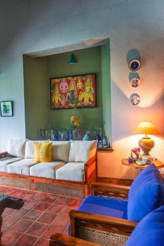 a living room with a couch and a table at The Fern Cove Villa - Colombo in Battaramulla