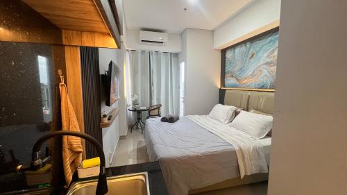 Ένα ή περισσότερα κρεβάτια σε δωμάτιο στο Ocean View Romantic studio by Dandelion The Bay