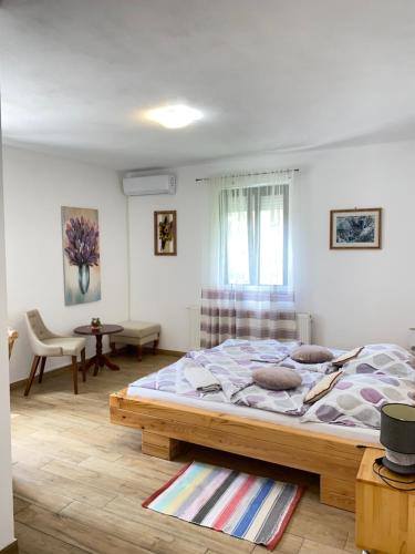 a bedroom with a large bed in a room at House Maka in Rudanovac