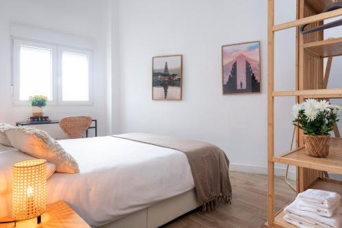 Ένα ή περισσότερα κρεβάτια σε δωμάτιο στο Calma Muralla House-Two bedrooms & two bathrooms