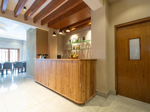 a lobby with a bar and a dining room at Hotel Samye - Best Hotel In Thimphu in Thimphu