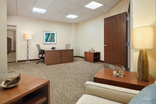 an office cubicle with a couch and a desk at The Westin San Diego Bayview in San Diego