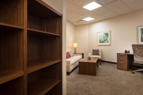 a living room with a couch and a desk in a room at The Westin San Diego Bayview in San Diego