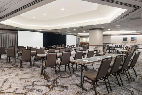 a conference room with tables and chairs and a projection screen at The Westin San Diego Bayview in San Diego