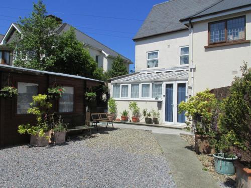 a house with a gravel driveway in front of it at Puffin Place,Lloyd House in Haverfordwest
