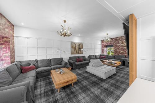 a living room with a couch and a table at The Redwell Country Inn in Arkholme