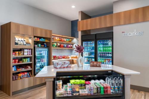 a drink station in a grocery store with drinks at Residence Inn by Marriott Arvada Denver West in Arvada