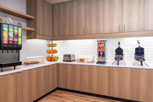 a kitchen with a counter with food on it at Residence Inn by Marriott Arvada Denver West in Arvada
