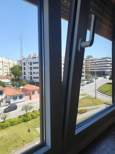 a window with a view of a city street at Best of nature 2, Matosinhos beach, PortoCityParc Metro! in Matosinhos