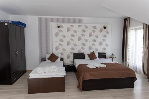 Katil atau katil-katil dalam bilik di Hotel Rodiv