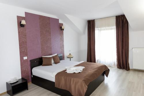 Katil atau katil-katil dalam bilik di Hotel Rodiv