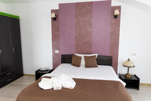 Katil atau katil-katil dalam bilik di Hotel Rodiv