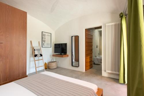 Ein Bett oder Betten in einem Zimmer der Unterkunft Podere Castellare