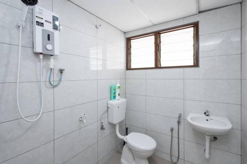 a bathroom with a toilet and a sink at Dream - Autumn at Pinji Ipoh Town in Ipoh