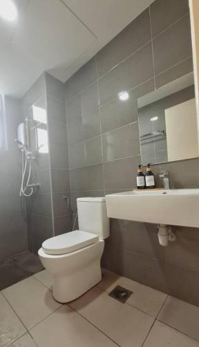 a bathroom with a toilet and a sink at Imperium Residence 1 Queen bed Sea View in Kuantan