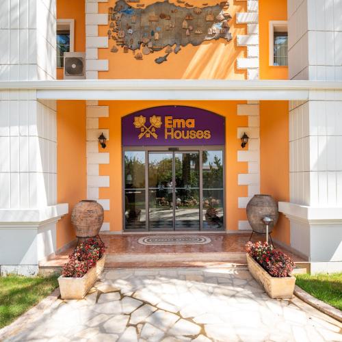 a entrance to a building with a sign on it at Ema Houses in Antalya