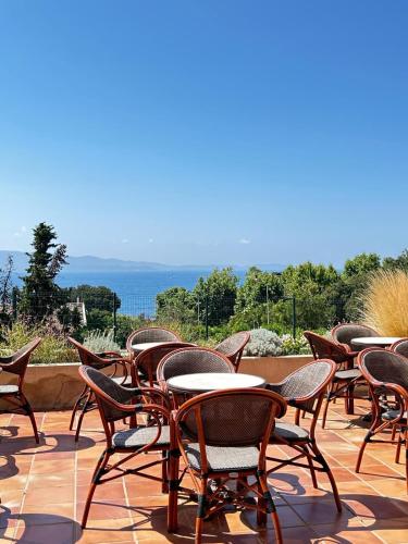 a row of chairs and tables on a patio at Sun Beach in Ajaccio