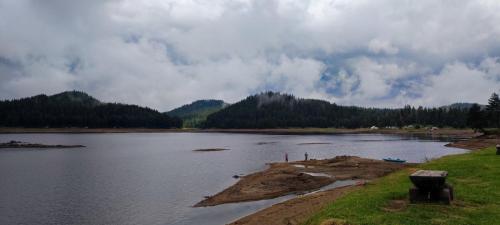 a large body of water with mountains in the background at Romantica Forest Guest House in Dospat