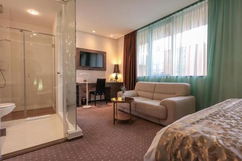 Postel nebo postele na pokoji v ubytování Hotel Nartel