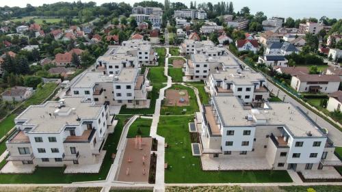an aerial view of a city with white houses at BIRGÉS Villapark Apartments in Balatonfüred
