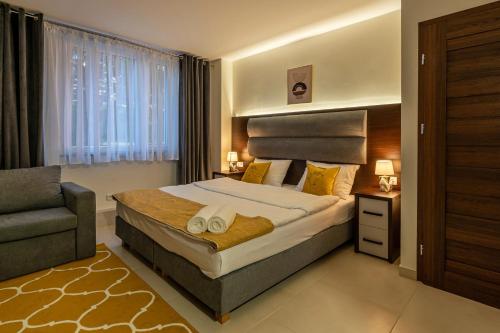 Posteľ alebo postele v izbe v ubytovaní Apartamenty Wakacyjna Wioska Ngô 20m od Suntago
