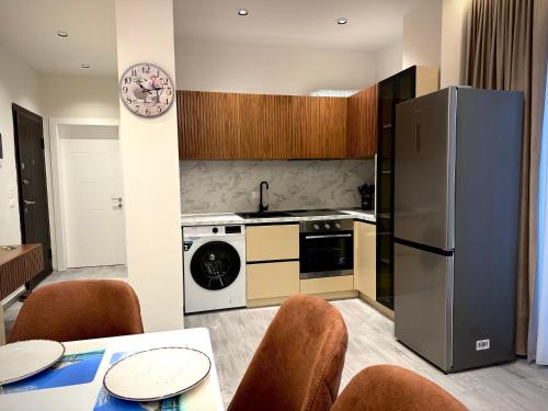 Kuchyň nebo kuchyňský kout v ubytování Roman Apartments