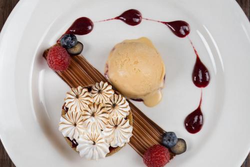 a plate of food with ice cream and desserts at Nevis Bank Inn in Fort William