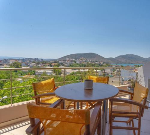 a table and chairs on a balcony with a view at Urban Breeze Chalkida in Chalkida