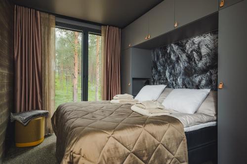 Ένα ή περισσότερα κρεβάτια σε δωμάτιο στο Snowbird Villas Levi, Arctic Nook
