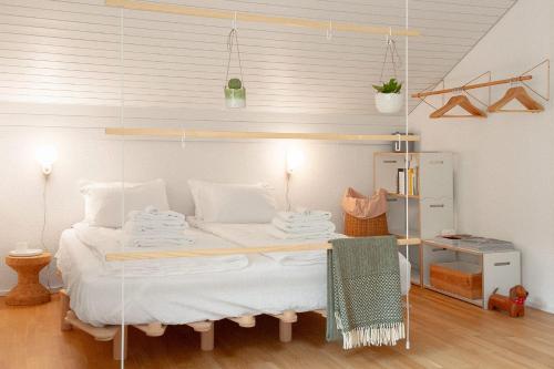 a bedroom with a bed with a glass wall at Kerenzer15 - The Studio in Mollis