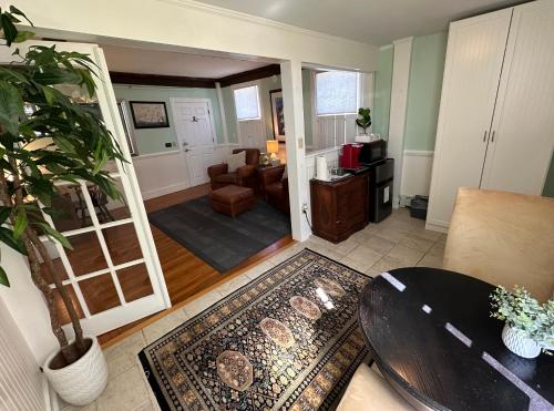 a living room with a table and a couch at Entire Historic 5 Bed 5 Bath Inn Sleeps 17 in Newport
