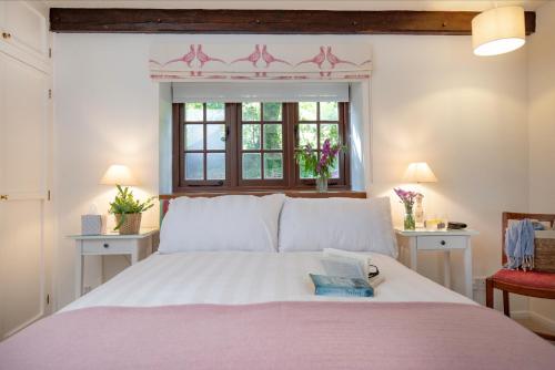 Voodi või voodid majutusasutuse Whitley Farm Cottage toas