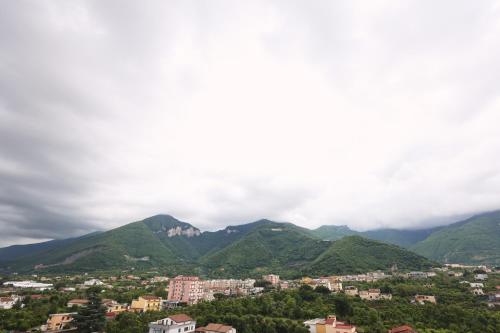 a view of a city with mountains in the background at Napodano Apartments - Napoli Salerno in Sant'Egidio del Monte Albino
