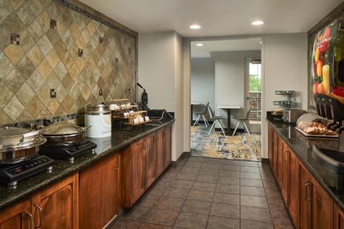 a kitchen with a counter with pots and pans at TownePlace Suites by Marriott Colorado Springs South in Colorado Springs
