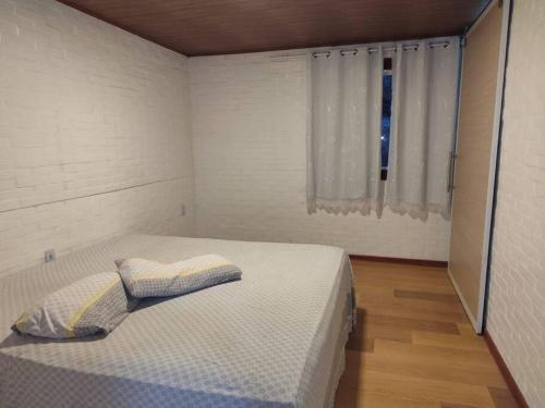 Ένα ή περισσότερα κρεβάτια σε δωμάτιο στο Casa em Domingos Martins