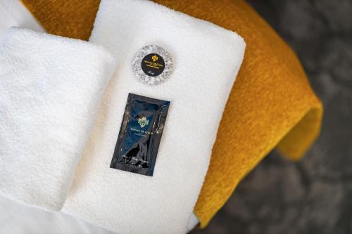 a close up of a white shirt with a sticker on it at A1 Royal Plaza in Prague