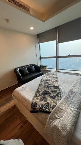 Ένα ή περισσότερα κρεβάτια σε δωμάτιο στο Elysium Service Apartment, Islamabad