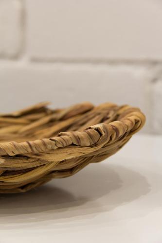 a wicker basket sitting on top of a table at Novus Homes Barcelona Santa Eulalia in Hospitalet de Llobregat
