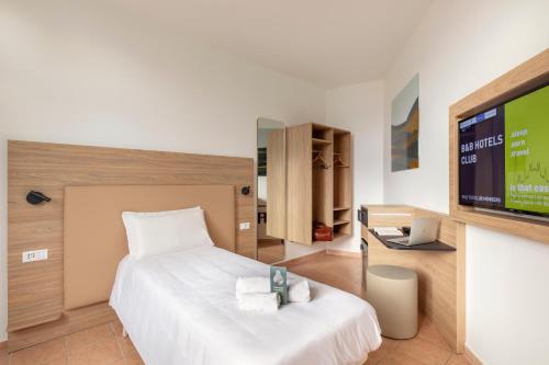 TV a/nebo společenská místnost v ubytování B&B Hotel Pomezia Roma