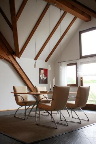 a dining room with a table and chairs at Gasthof zum Grünen Baum Komfort Suite in Rothenburg ob der Tauber