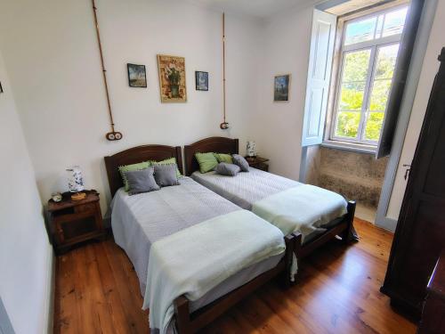 Ένα ή περισσότερα κρεβάτια σε δωμάτιο στο Casa Folhas Novas