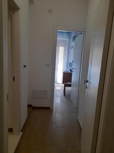 a hallway with a door leading to a room at Beach Rooms 1 Self Check-in in Alghero