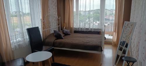 En eller flere senge i et værelse på DW Jantar