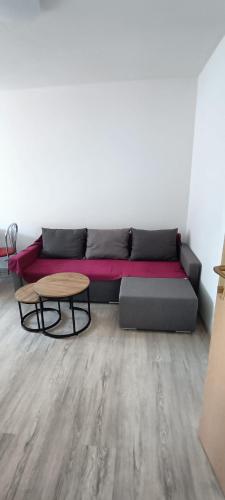 a living room with a couch and a table at Apartments pasta in Poljica