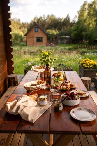 a wooden table with food on top of it at Głuszecki las in Skórcz