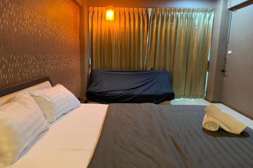 Ένα ή περισσότερα κρεβάτια σε δωμάτιο στο 41BKK Hotel Rama9