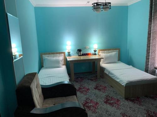 Katil atau katil-katil dalam bilik di Mulberry Hotel
