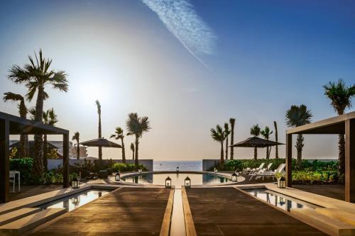 a rendering of a resort with a pool and the ocean at Bvlgari Resort Dubai in Dubai